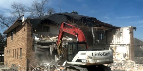 Demolition of structure by big equipment